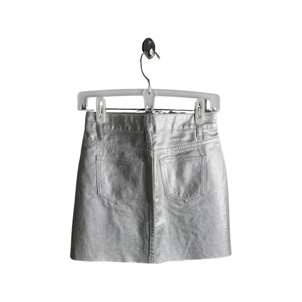 Forever 21 Silver faux leather raw hem mini skirt size small with 5 pockets.